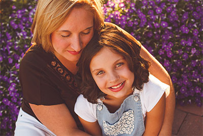 Mother holding daughter